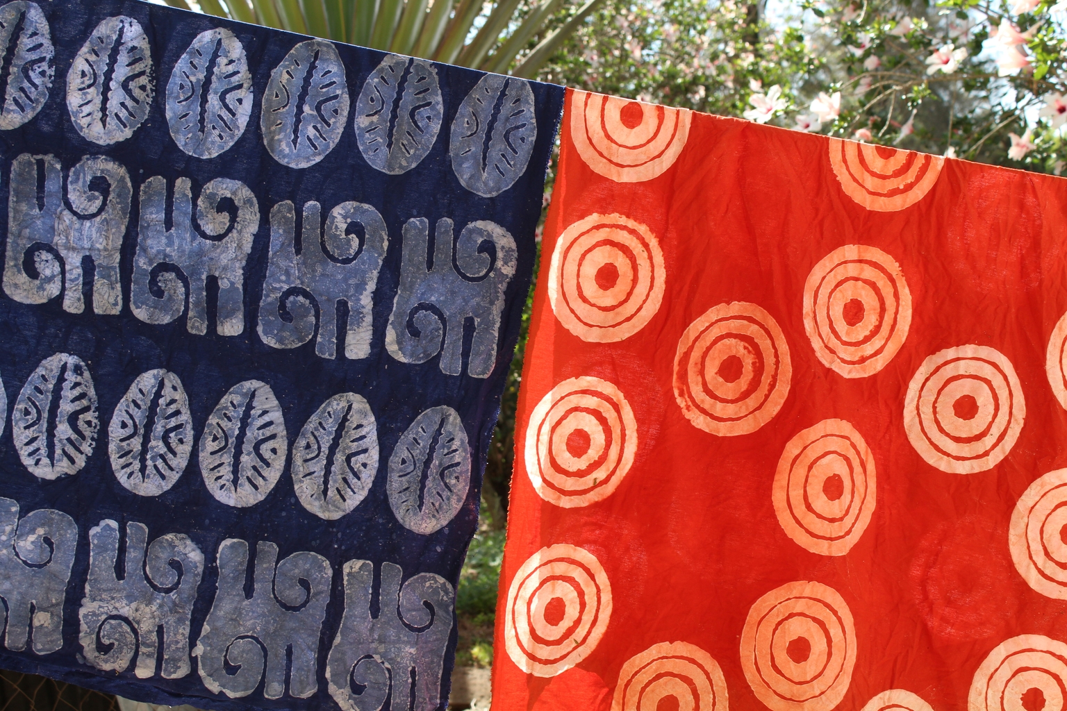 Patterned batik cloth hanging in the sun
