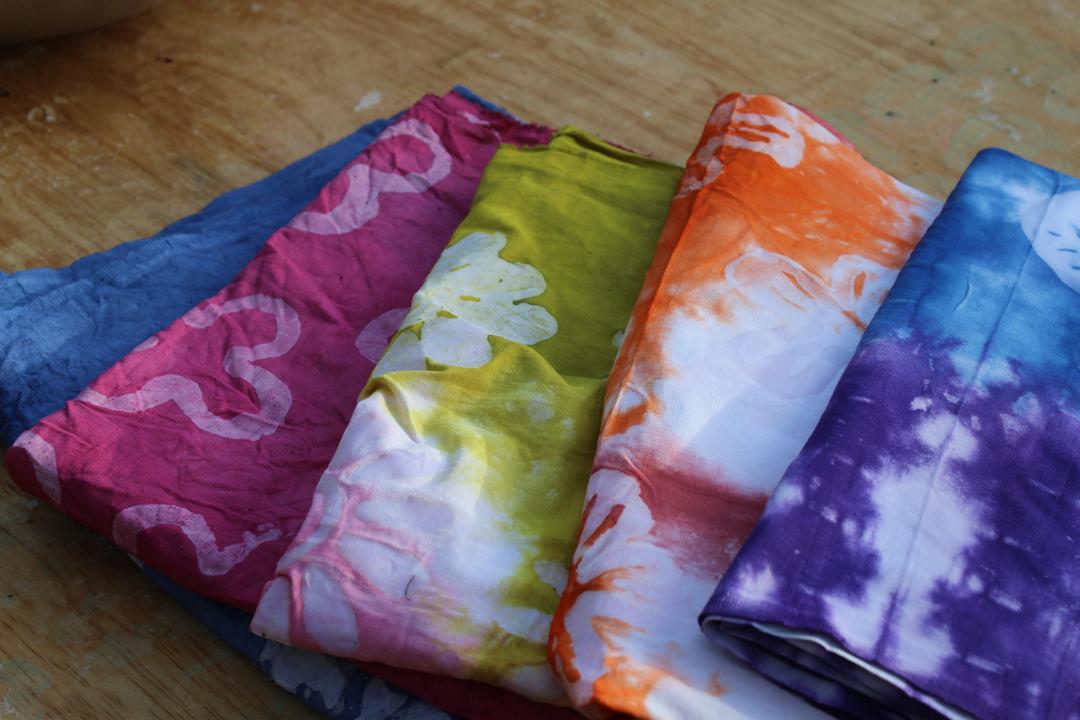 Stacked batik cloth showing layered patterns and color