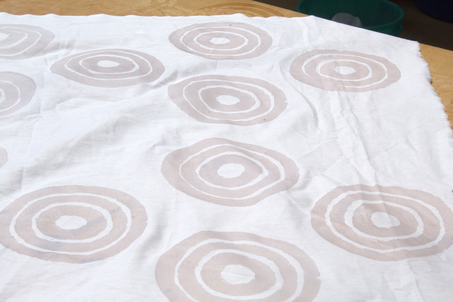 White cloth marked with circular wax patterns